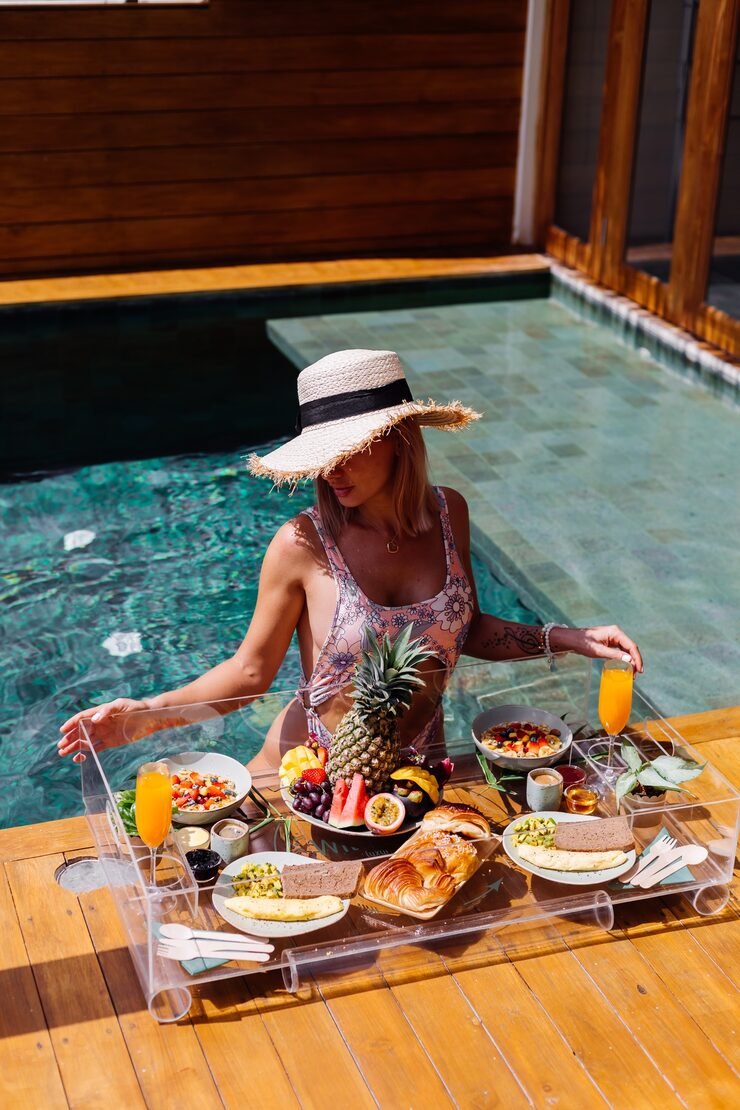 beautiful-caucasian-tanned-woman-bikini-straw-hat-with-floating-breakfast-amazing-luxury-bali-style-villa-sunny-day-by-swimming-pool-tropical-background_343596-1025